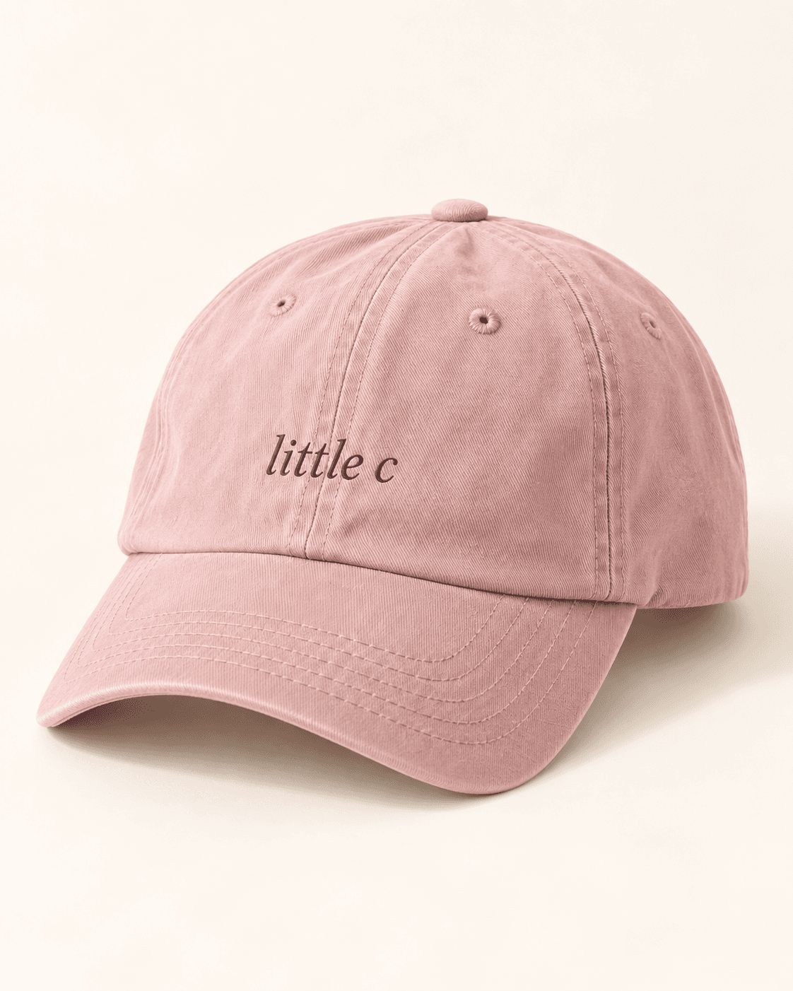 The little c dad hat — rose product mockup with “little c” lettering.