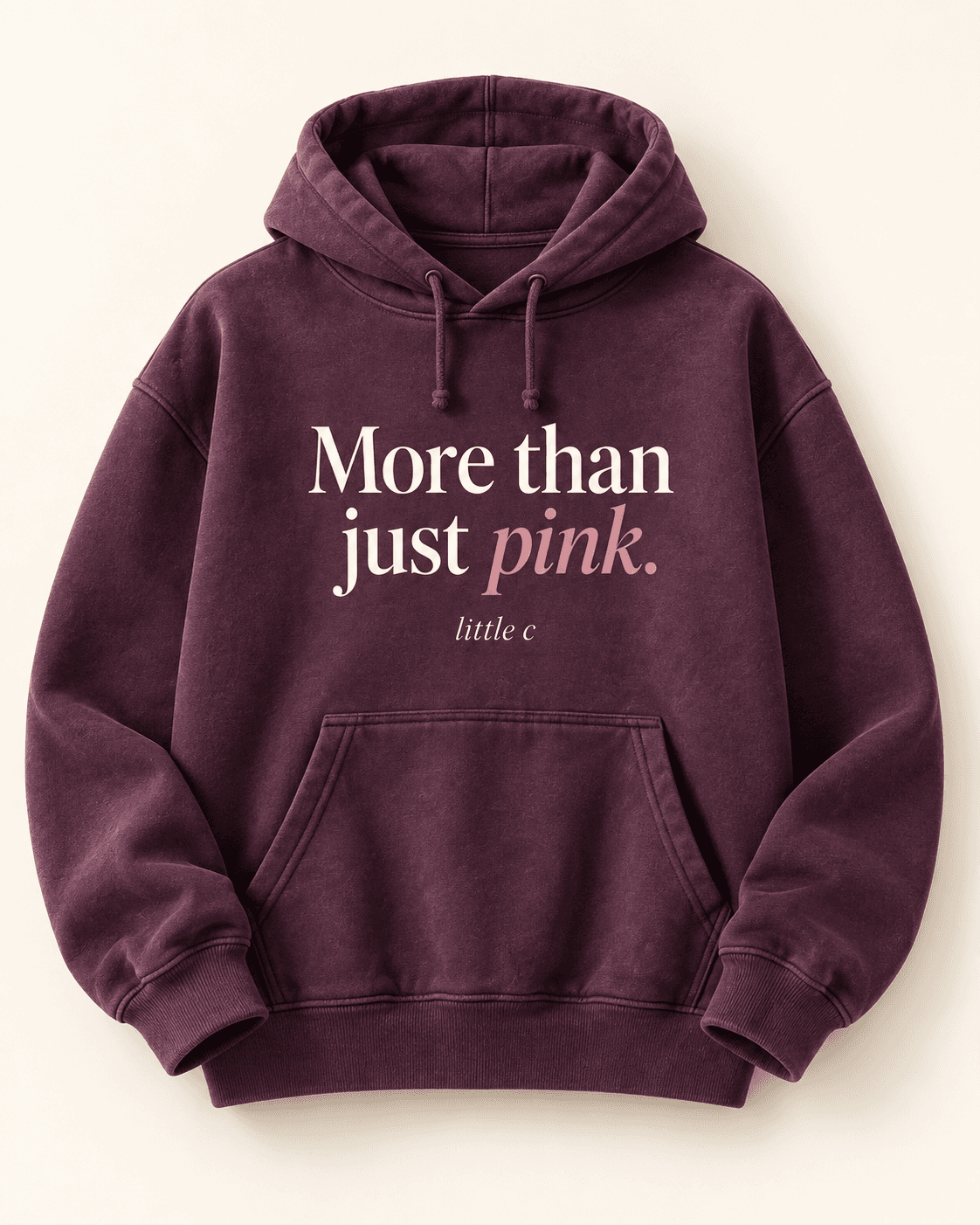 More than just pink hoodie — plum product mockup with “More than just pink.” lettering.